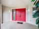 Red double front doors with glass panels and a doormat at 121 Van Dyck Dr # Dr, Nokomis, FL 34275