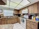 Well-equipped kitchen with white appliances and wood cabinets at 121 Van Dyck Dr # Dr, Nokomis, FL 34275