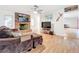 Living room with a brown sectional sofa and brick fireplace at 121 Van Dyck Dr, Nokomis, FL 34275