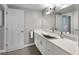 Bathroom with white vanity, vessel sink, and gray walls at 1212 Benjamin Franklin Dr # 305, Sarasota, FL 34236