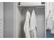 White closet with bathrobes hanging neatly at 1212 Benjamin Franklin Dr # 305, Sarasota, FL 34236