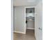 Well-organized hall closet with extra storage space at 1212 Benjamin Franklin Dr # 305, Sarasota, FL 34236