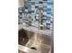 Stainless steel sink with modern faucet at 1212 Benjamin Franklin Dr # 305, Sarasota, FL 34236