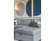 Gray sectional sofa with pillows and built in storage at 1212 Benjamin Franklin Dr # 305, Sarasota, FL 34236