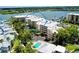 Luxury condo building with waterfront access and a pool at 1260 Dolphin Bay Way # 303, Sarasota, FL 34242