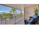 Relaxing balcony overlooking water and lush tropical landscape at 1260 Dolphin Bay Way # 303, Sarasota, FL 34242