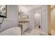 Bathroom with soaking tub and walk-in shower at 1260 Dolphin Bay Way # 303, Sarasota, FL 34242