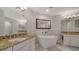 Elegant bathroom with a large soaking tub and double vanity at 1260 Dolphin Bay Way # 303, Sarasota, FL 34242