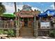 Cottage on the Key restaurant with outdoor seating and a fish sign at 1260 Dolphin Bay Way # 303, Sarasota, FL 34242