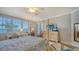 Main bedroom with king-size bed and access to balcony at 1260 Dolphin Bay Way # 303, Sarasota, FL 34242