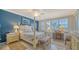 Spacious bedroom with a post bed and built-in desk at 1260 Dolphin Bay Way # 303, Sarasota, FL 34242