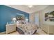 Guest bedroom with coastal decor and comfortable bed at 1260 Dolphin Bay Way # 303, Sarasota, FL 34242