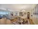 Elegant dining area with hardwood floors and chandelier at 1260 Dolphin Bay Way # 303, Sarasota, FL 34242