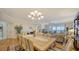 Elegant dining room with hardwood floors and chandelier at 1260 Dolphin Bay Way # 303, Sarasota, FL 34242