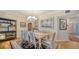 Elegant dining room featuring a formal table and chairs, with hardwood floors at 1260 Dolphin Bay Way # 303, Sarasota, FL 34242