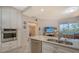 Modern kitchen with stainless steel appliances and granite countertops at 1260 Dolphin Bay Way # 303, Sarasota, FL 34242