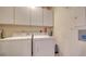 Laundry room with full-size washer and dryer at 1260 Dolphin Bay Way # 303, Sarasota, FL 34242