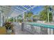 Relaxing pool area with pergola and lounge chairs, offering resort-style living at 1260 Dolphin Bay Way # 303, Sarasota, FL 34242