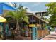 Paradise Found Tiki Bar's outdoor seating area, featuring a bamboo fence and tropical plants at 1260 Dolphin Bay Way # 303, Sarasota, FL 34242