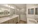 Double vanity bathroom with quartz countertops and shower at 12649 Palatka Dr, Venice, FL 34293