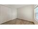 Well-lit bedroom featuring tile floors and a double-door closet at 12649 Palatka Dr, Venice, FL 34293