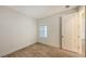 Bright bedroom with tile floors and a door to the bathroom at 12649 Palatka Dr, Venice, FL 34293