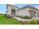 House exterior showcasing a walkway and landscaping at 12649 Palatka Dr, Venice, FL 34293