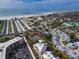 Aerial view of Dolphin Bay community, highlighting tennis courts and building location at 1280 Dolphin Bay Way # 202, Sarasota, FL 34242