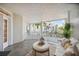 Spacious balcony with outdoor furniture, offering relaxing water views at 1280 Dolphin Bay Way # 202, Sarasota, FL 34242