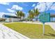 Modern beach pavilion with grassy area and historical marker at 1280 Dolphin Bay Way # 202, Sarasota, FL 34242