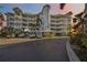 Attractive building exterior with ample parking at 1280 Dolphin Bay Way # 202, Sarasota, FL 34242