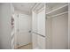 Spacious closet with shelving and hanging rods at 1280 Dolphin Bay Way # 202, Sarasota, FL 34242