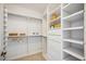 Large walk-in closet with ample shelving and drawers at 1280 Dolphin Bay Way # 202, Sarasota, FL 34242