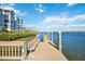 Enjoy the community dock with a bench and water views at 1280 Dolphin Bay Way # 202, Sarasota, FL 34242