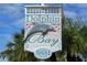 Dolphin Bay community entrance sign, 5831 Private, welcoming residents and guests at 1280 Dolphin Bay Way # 202, Sarasota, FL 34242