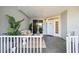 Inviting front porch with seating area, perfect for relaxing at 1280 Dolphin Bay Way # 202, Sarasota, FL 34242