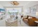 Elegant living room featuring water views and comfy seating at 1280 Dolphin Bay Way # 202, Sarasota, FL 34242