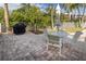 Relaxing patio with seating area and built-in grill at 1280 Dolphin Bay Way # 202, Sarasota, FL 34242