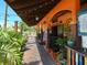 Outdoor patio seating at a restaurant with plants at 1280 Dolphin Bay Way # 202, Sarasota, FL 34242