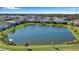 Aerial view of neighborhood homes around a pond at 12915 True Blue Cir, Bradenton, FL 34211