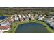 Aerial view of a neighborhood with houses near a pond at 12915 True Blue Cir, Bradenton, FL 34211