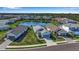 Aerial view of a neighborhood with houses and pond at 12915 True Blue Cir, Bradenton, FL 34211