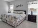 Main bedroom with a king-size bed and neutral decor at 12915 True Blue Cir, Bradenton, FL 34211