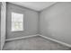 Empty bedroom with gray walls and gray carpeting at 12915 True Blue Cir, Bradenton, FL 34211