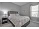 Bright bedroom with a double bed and gray carpeting at 12915 True Blue Cir, Bradenton, FL 34211