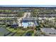 Aerial view of community pool, clubhouse, and lake at 12915 True Blue Cir, Bradenton, FL 34211