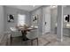 Dining room with wooden table and white chairs at 12915 True Blue Cir, Bradenton, FL 34211