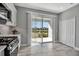 Kitchen with view of backyard and lake. Stainless steel appliances at 12915 True Blue Cir, Bradenton, FL 34211