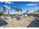 Relaxing pool area with lounge chairs and tables at 12915 True Blue Cir, Bradenton, FL 34211