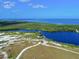 Aerial view of coastal community with observation tower and waterways at 1314 64Th W St, Bradenton, FL 34209